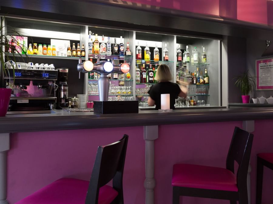 A lady at the bar counter at Hotel Eclipse