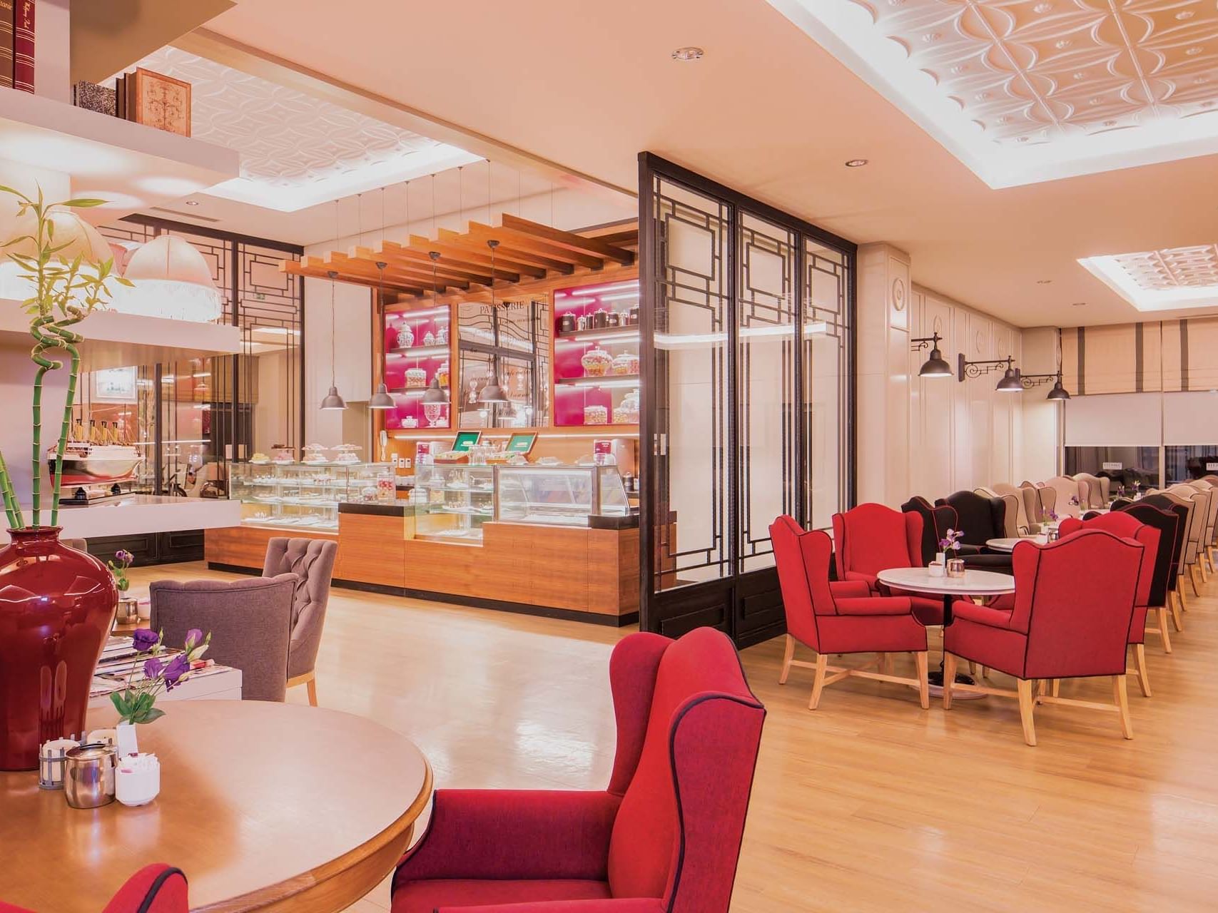 Food counter and the dining area in Caprice Patisserie at Titanic Deluxe Lara