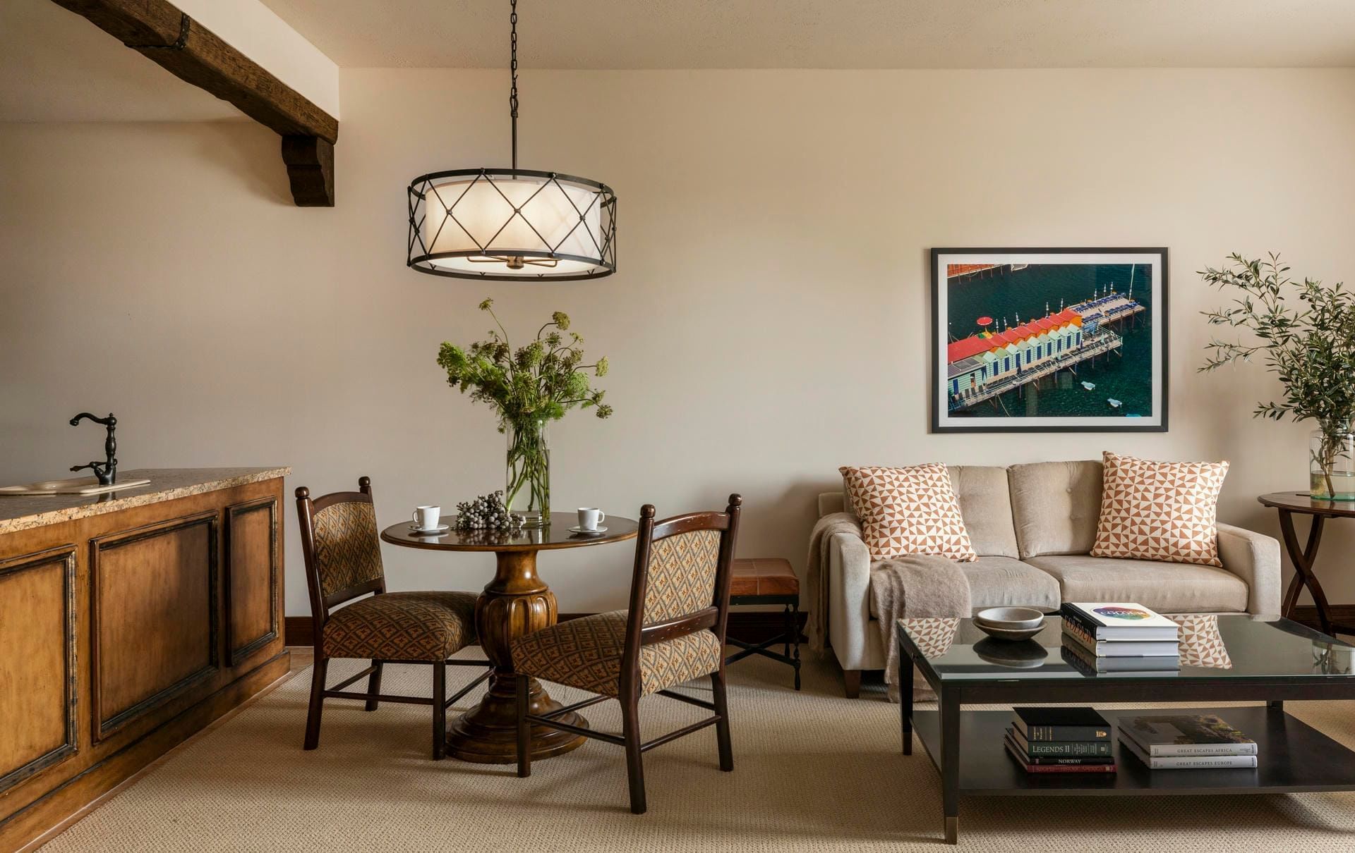 Cozy living area with sofa, dining table, and kitchenette at Granduca Houston, one of the top apartment hotels in Houston