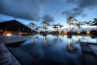 Night view of pool area at U NIMMAN CHIANG MAI