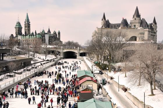 People ice skating on rideau canal near ReStays Ottawa