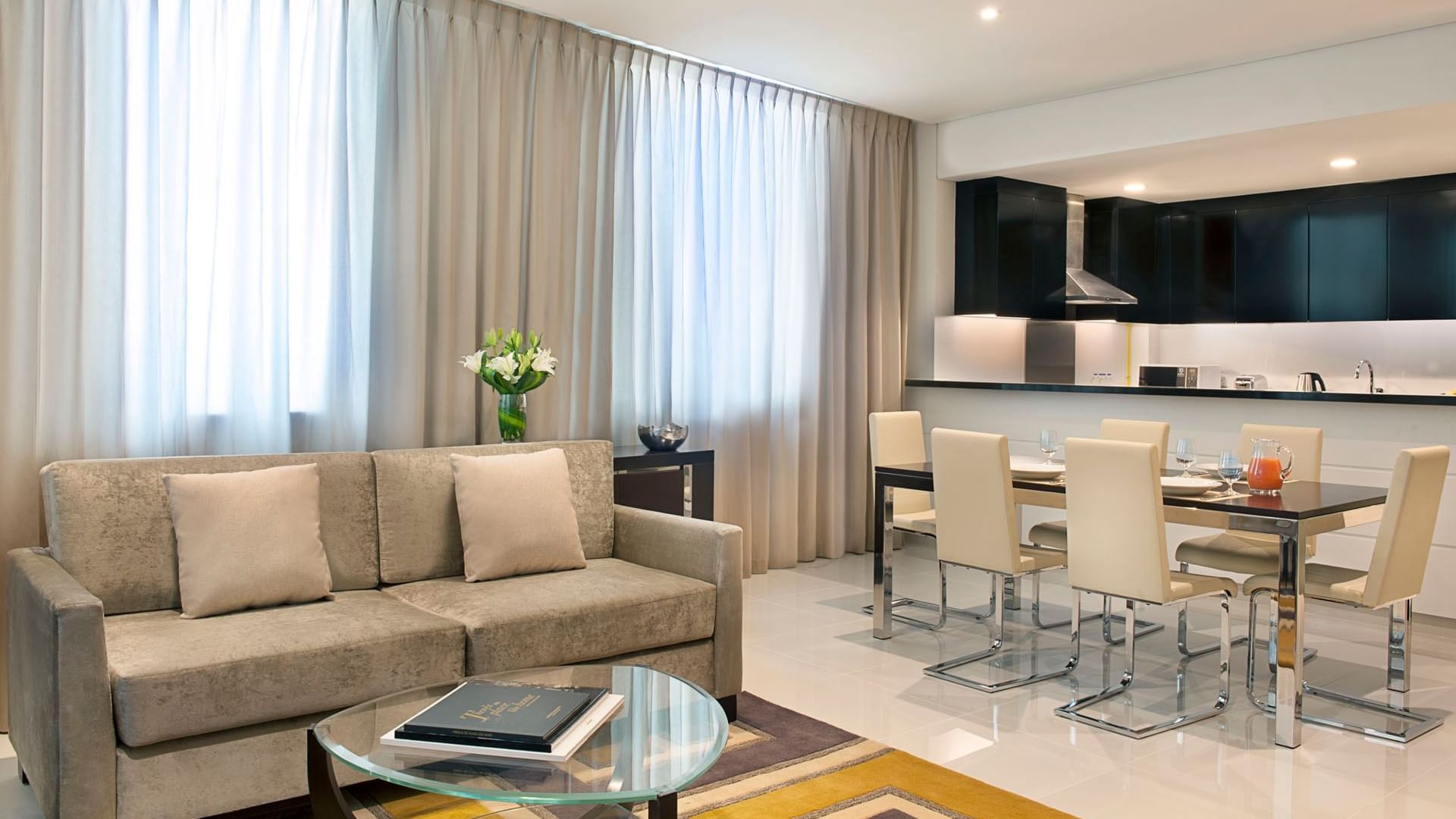 Elegant living room featuring modern furniture in Two Bedroom Suite at DAMAC Maison Cour Jardin