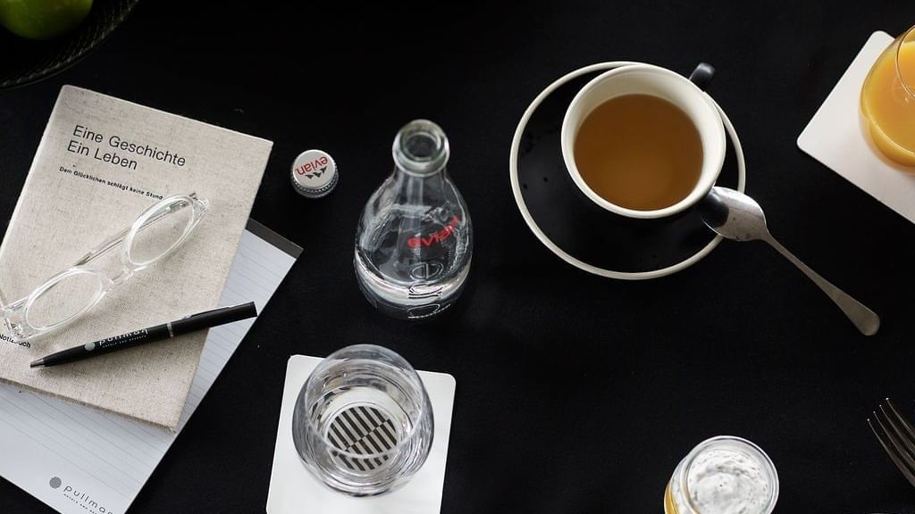 tea, papers & pen on the table at Pullman Melbourne on the park