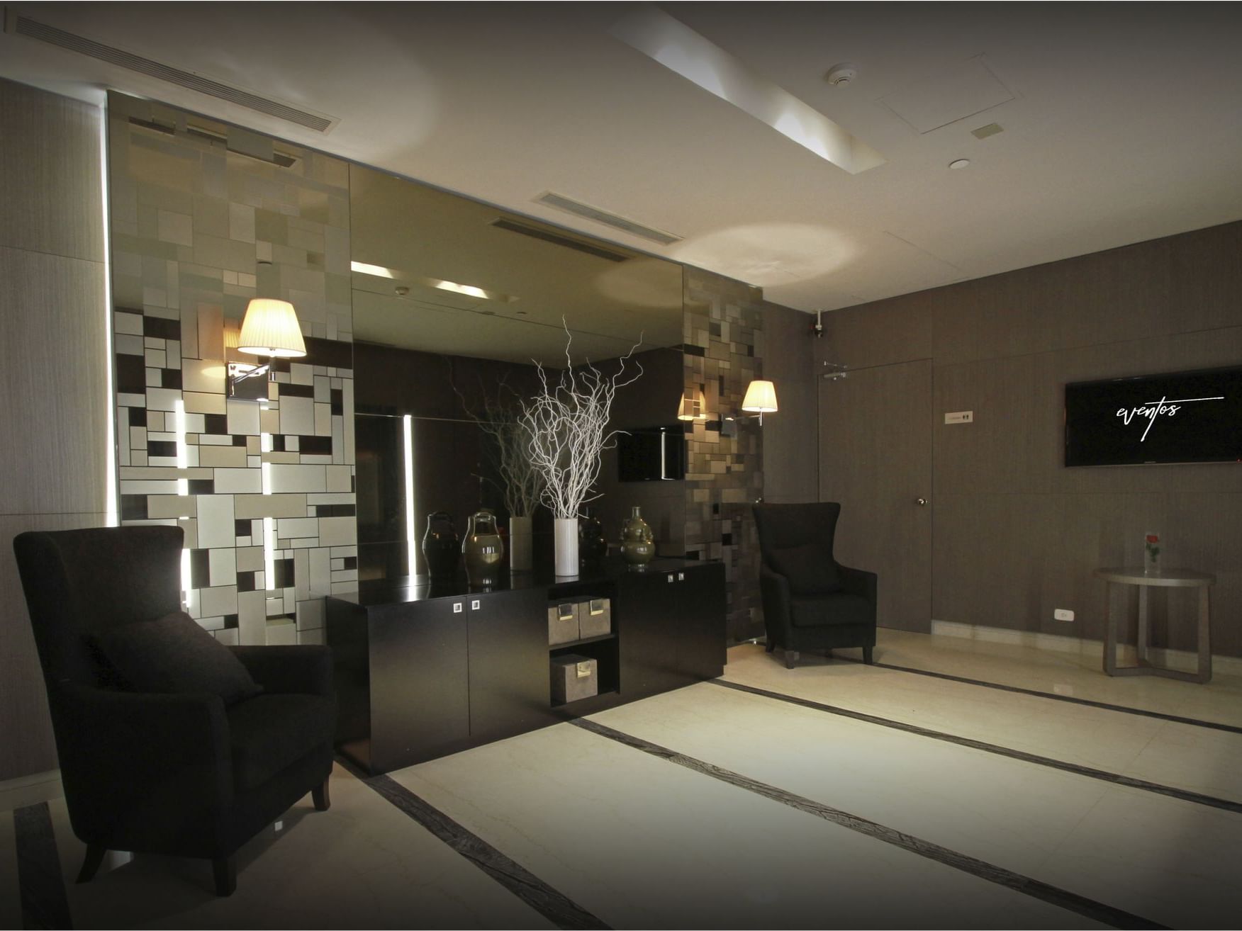Interior of lounge area in forum room at Recoleta Grand Hotel