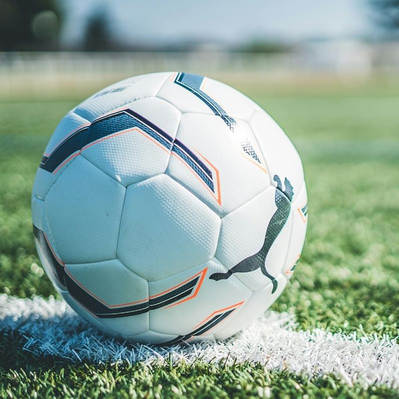 A ball sitting on a field. Photo by: Gregory Costa