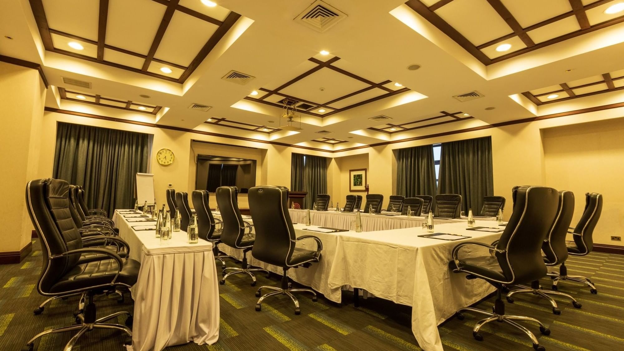Meeting room setup with long table and chairs at Lake Victoria Serena Golf Resort & Spa in Kampala.