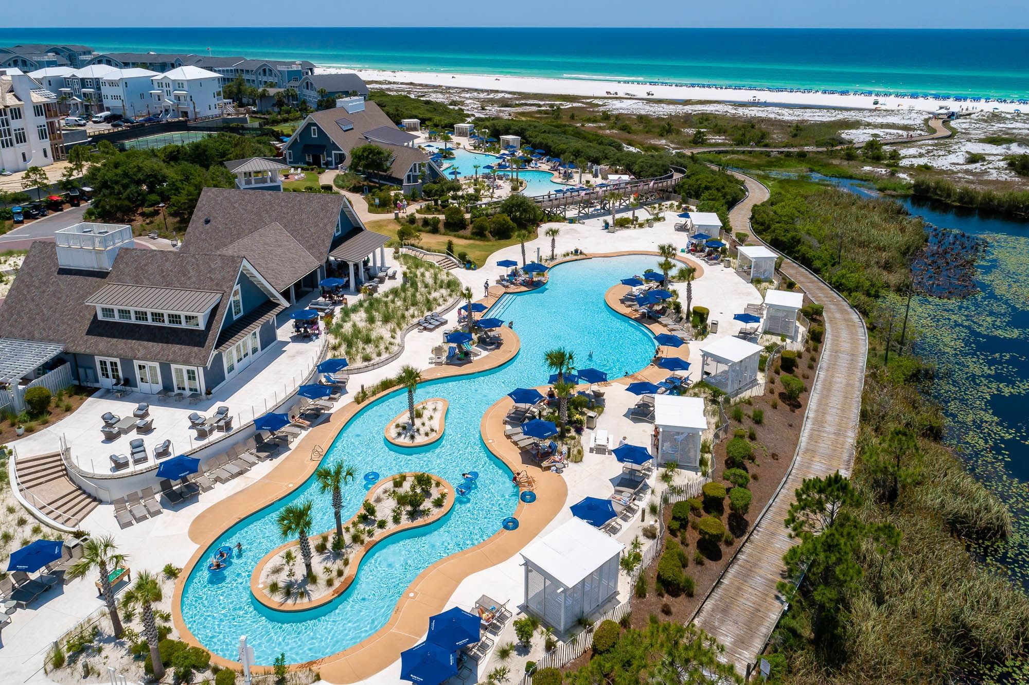 Aerial view of Watersound Beach Club pools, dining, and expansive private beach along the Gulf of Mexico