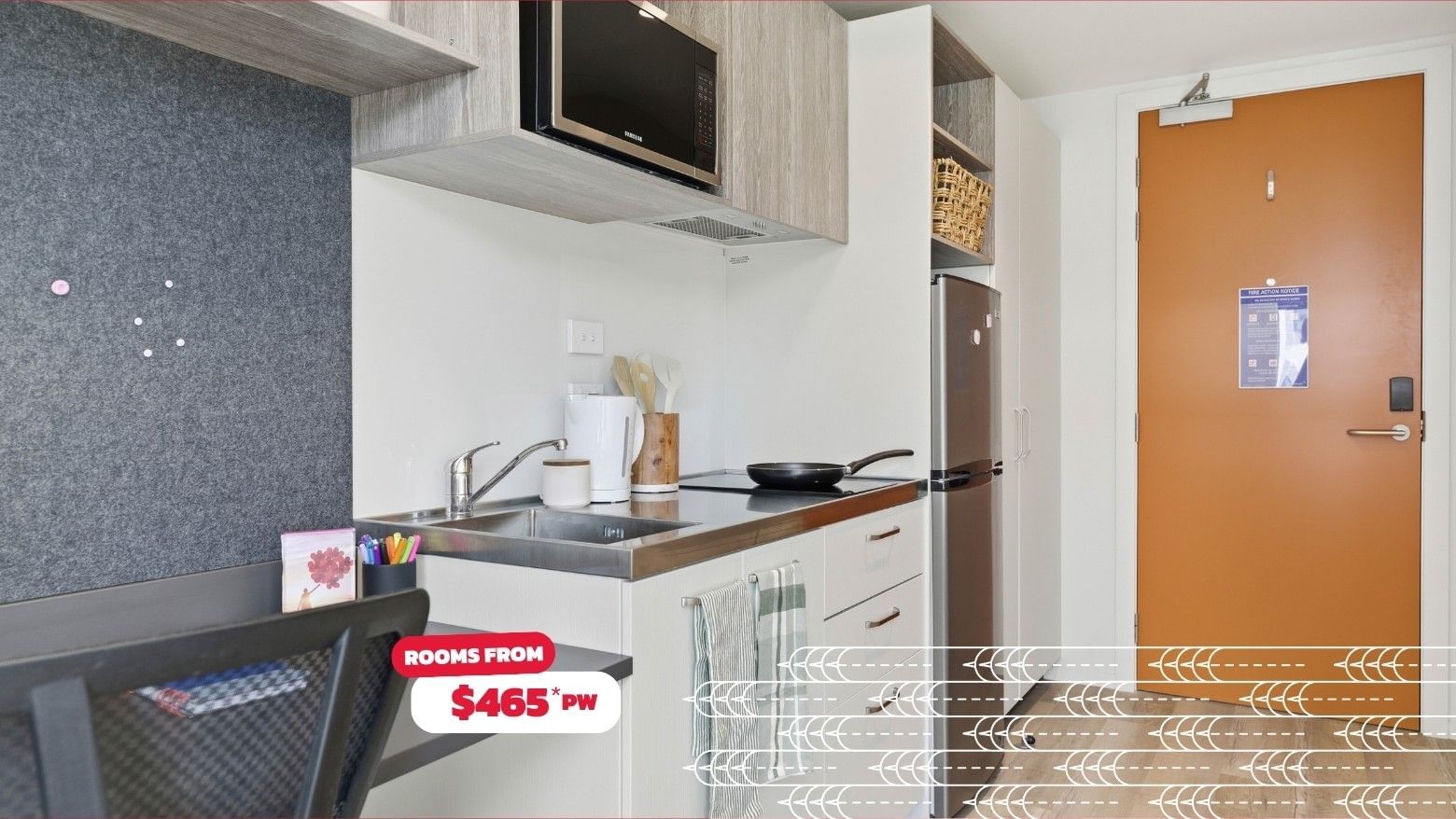 A small kitchen with sink, stove, fridge, and microwave at Mayoral Drive Student Accommodation.