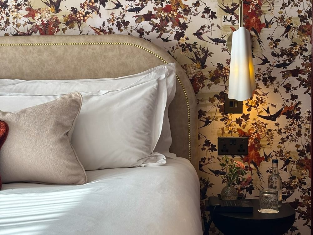 Close-up of bed with side table in Superior King / Twin at The Capital Hotel, Apartments Townhouse