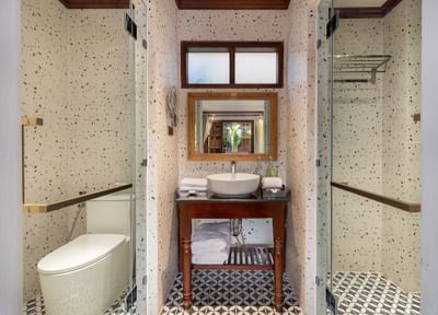 Vanity and shower area in Superior Pondside View at U Luang Prabang