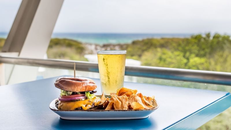 Closeup of burger & drink served at WaterColor Inn