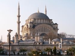 UNESCO-listed Nuruosmaniye Mosque in Istanbul features Baroque influence, a vast dome, and a tranquil atmosphere. 