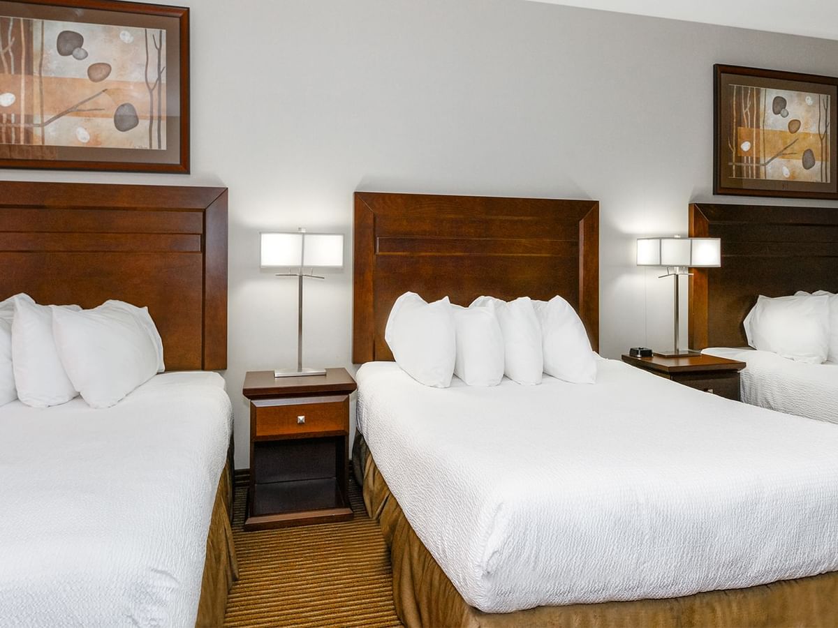 Hotel room with three queen beds