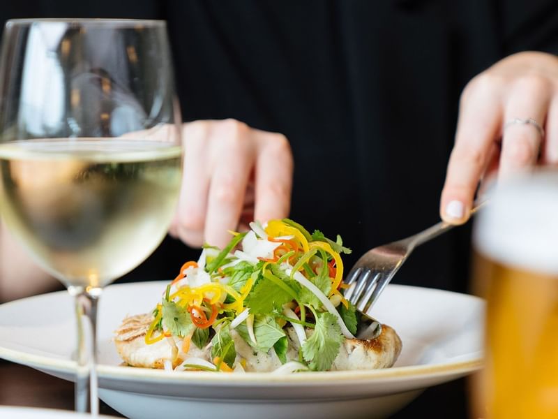 Client eating tasty Caesar salad in Market & Co at Crown Towers