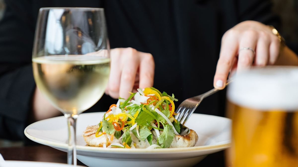 Client eating tasty Caesar salad in Market & Co at Crown Towers