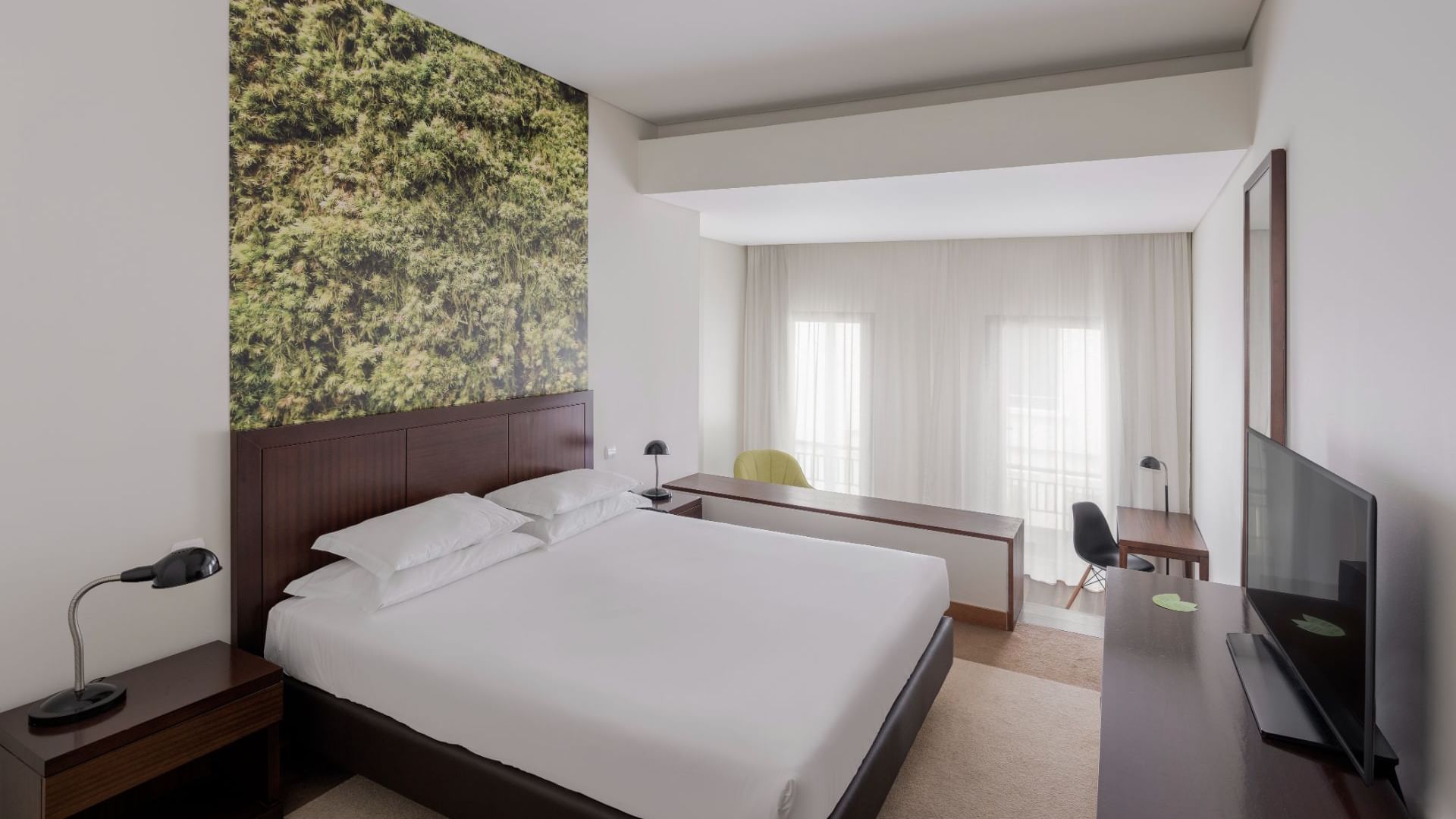 Comfy bed & TV in Standard Plus room, Bensaude Hotels