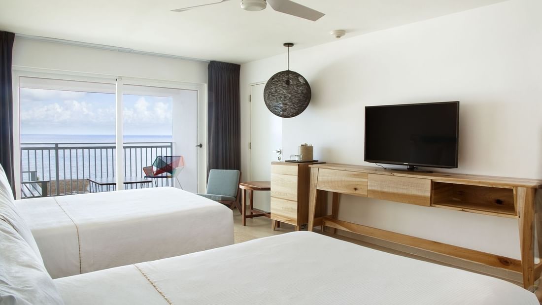 2 Double beds & TV in ocean view Deluxe at La Colección Resorts