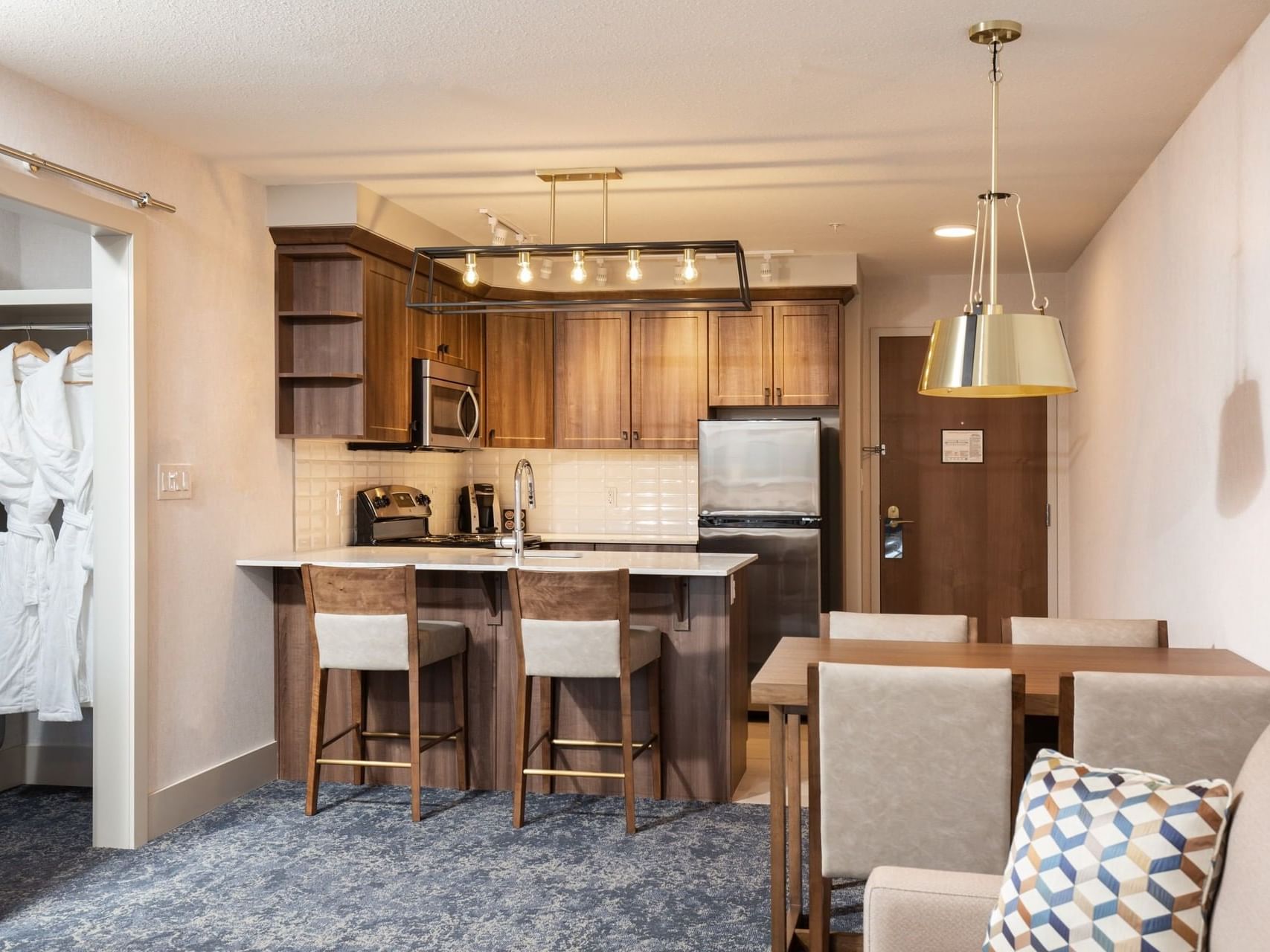 a dining table next to a kitchen