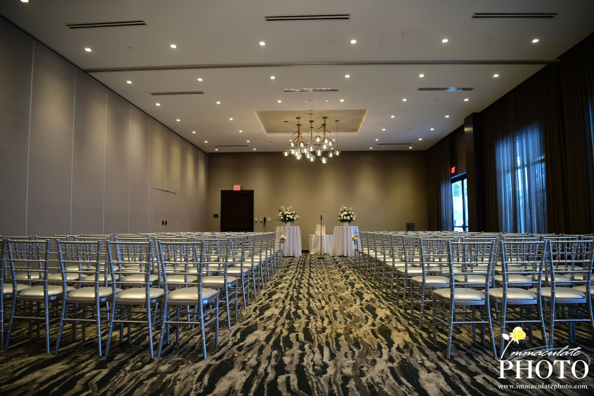 chairs set up for wedding in ballroom