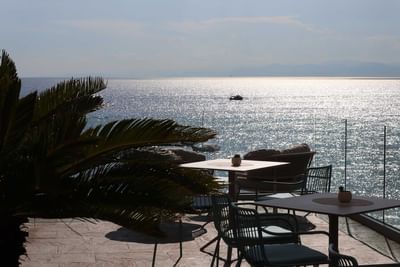 Table set-up on terrace with sea view at Sublimis Boutique Hotel Camogli