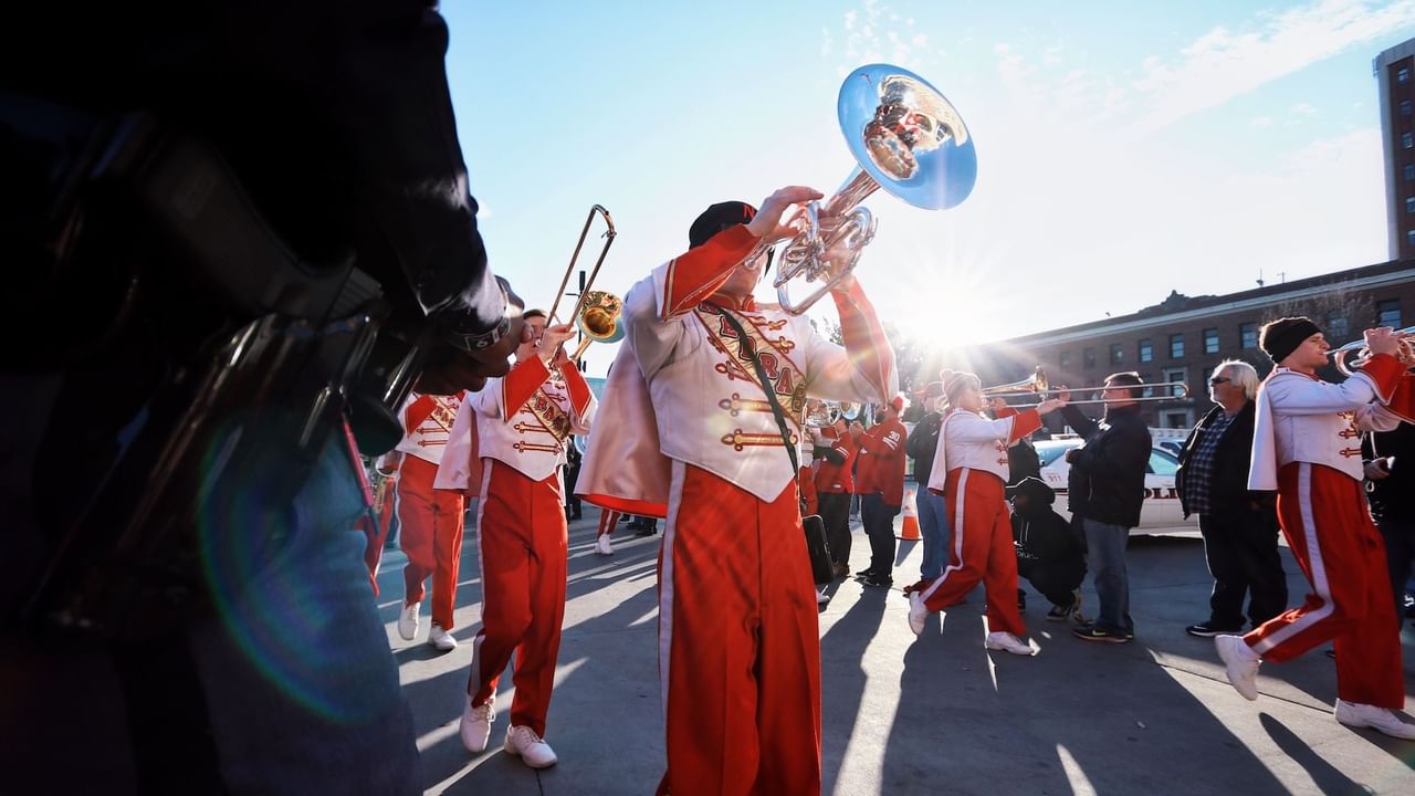 A band plays trumpets in a parade