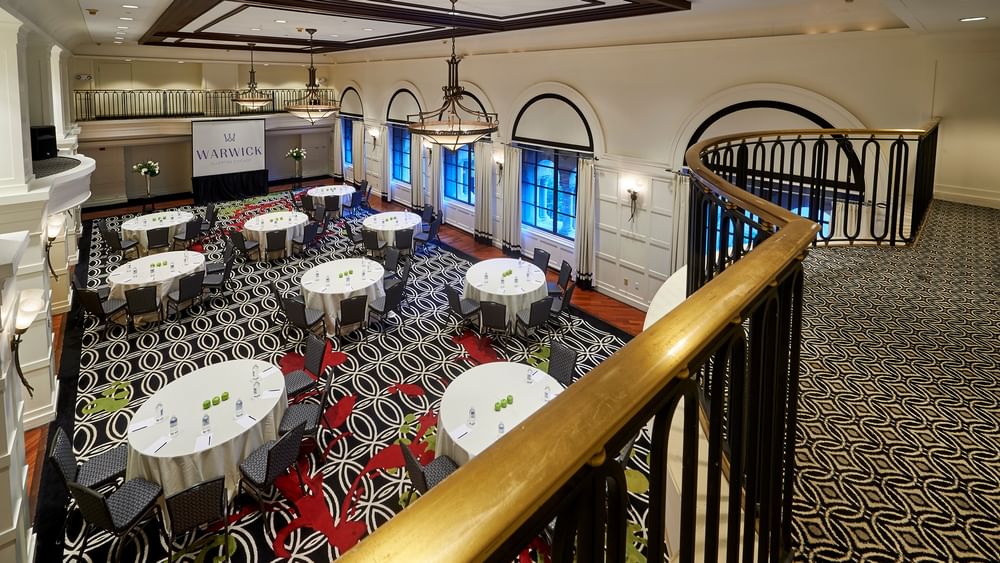 Elegant Buckingham Ballroom setup with tables and chairs at Warwick Allerton - Chicago.