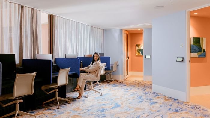 Person working at a modern co-working space.