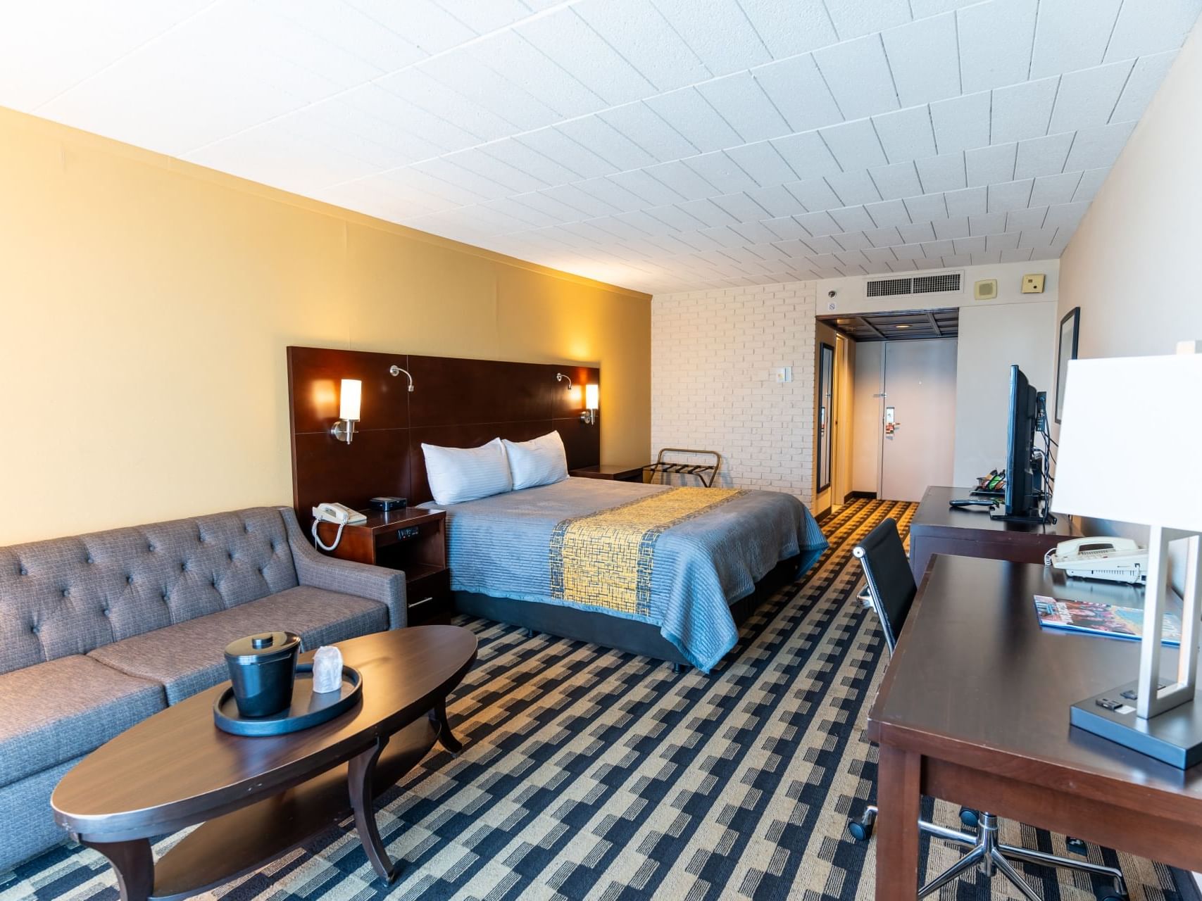 Working space by the lounge & king bed in King Parlour Suite at M Hotel Buffalo