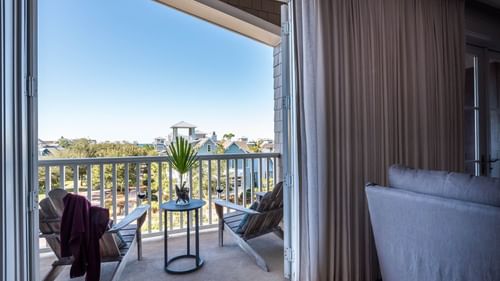 Premium Resort suite with a balcony view and balcony chairs at Watersound Inn