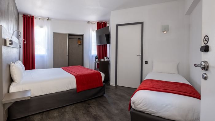 Single beds at Hotel Les Domes at The Originals Hotels