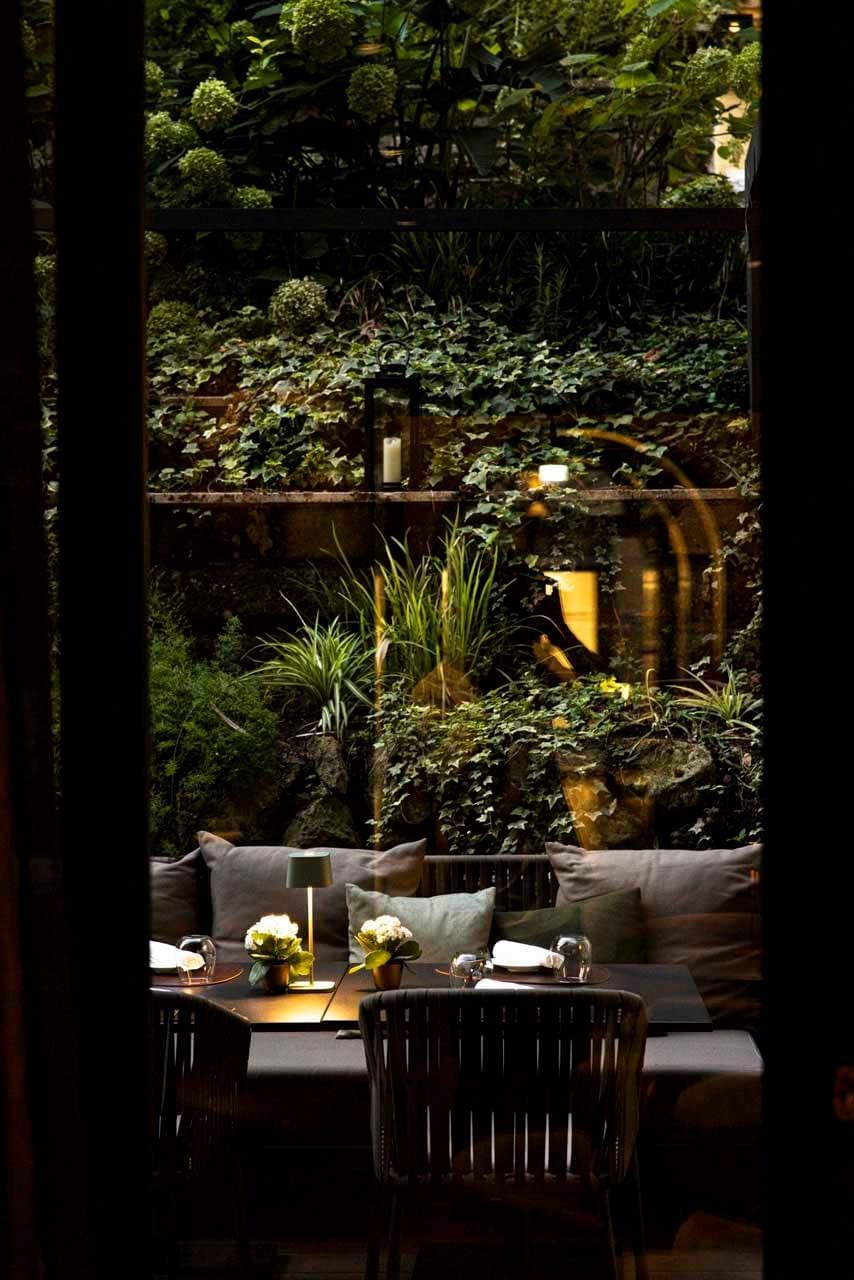 Interior & decor featuring couches and plants in EMME Restaurant at Margutta 19