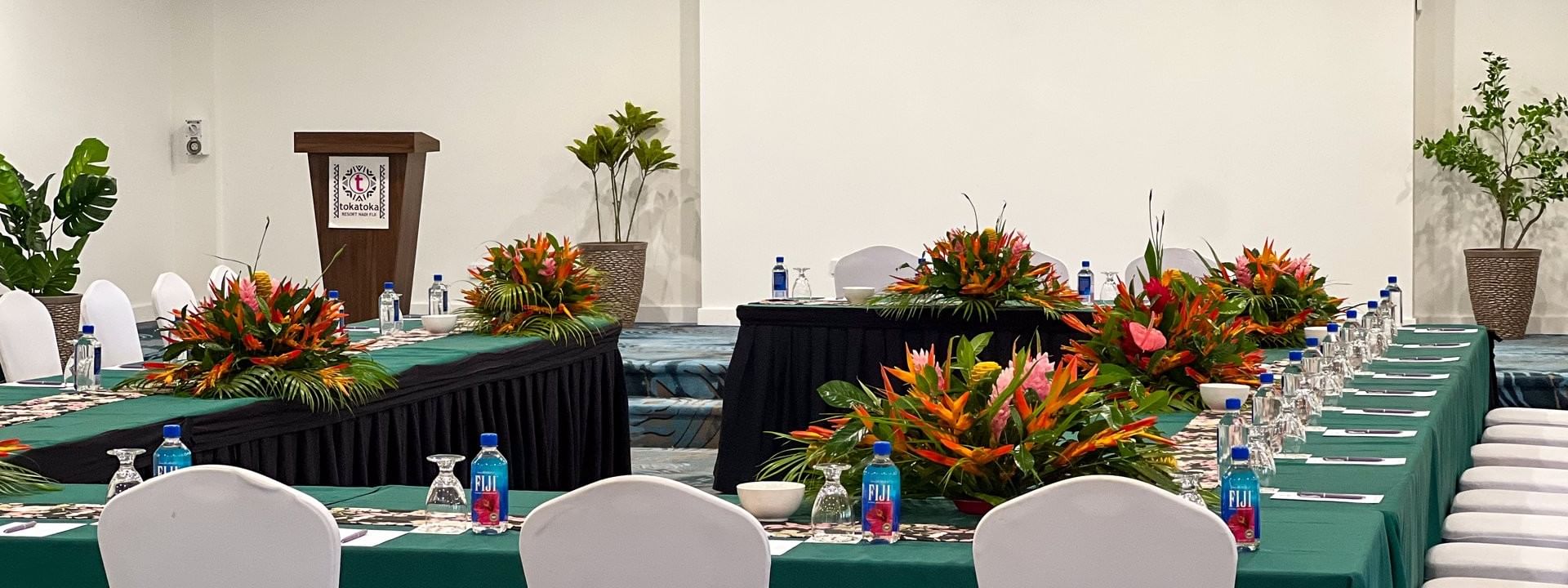 Talei Meeting Room with tables, chairs, and floral arrangements at Tokatoka Resort - Fiji International Airport, Nadi