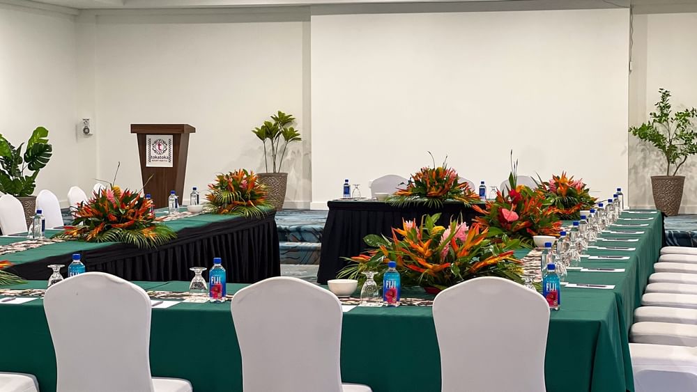 Talei Meeting Room with tables, chairs, and floral arrangements at Tokatoka Resort - Fiji International Airport, Nadi.