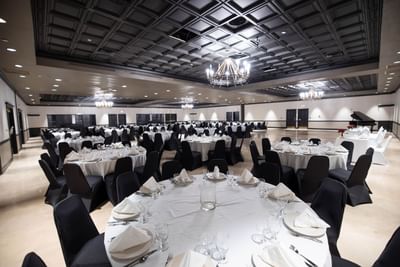 tables and chairs in a large even room