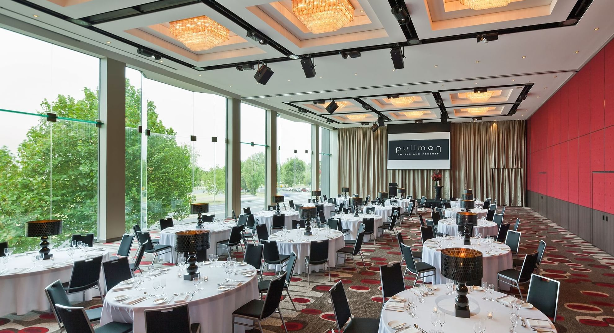 Banquet table set-up in Lake Room with carpeted floors at Pullman Albert Park