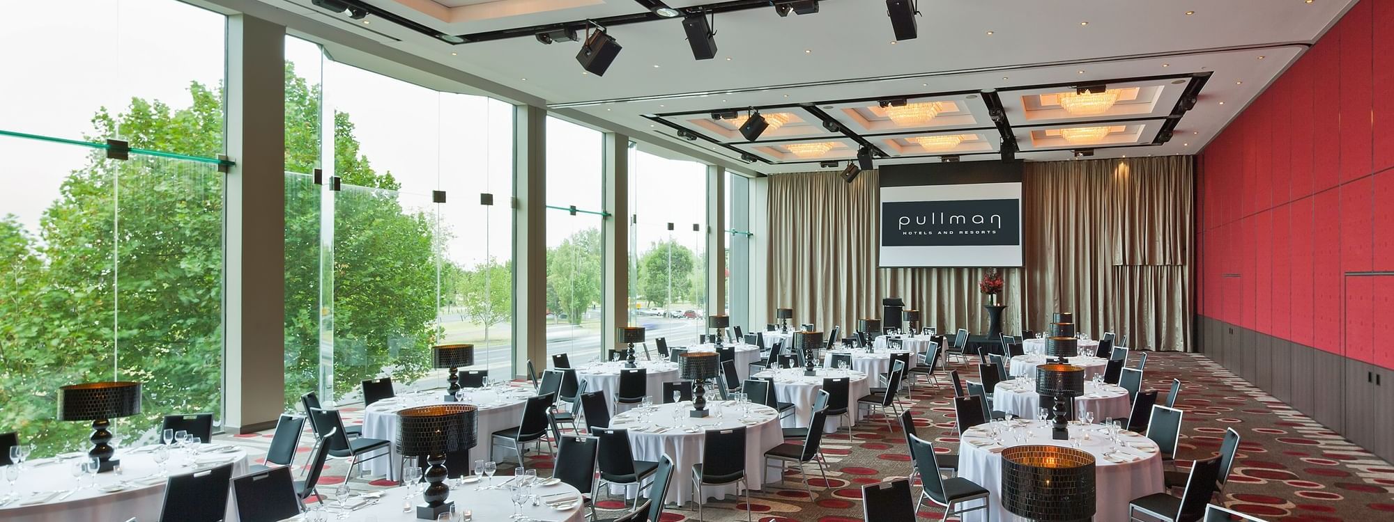 Banquet table set-up in Lake Room with carpeted floors at Pullman Albert Park