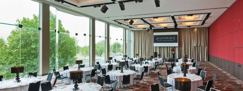 Banquet table set-up in Lake Room with carpeted floors at Pullman Albert Park