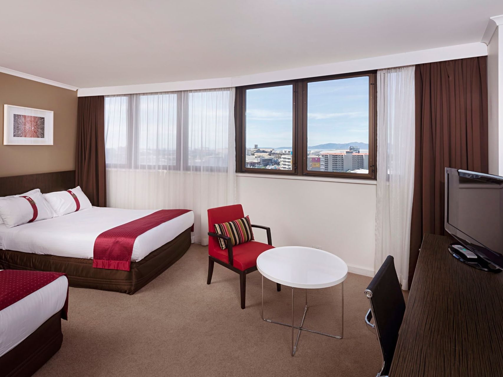 TV stand facing the twins beds in Standard Twin at Grand Chancellor Townsville