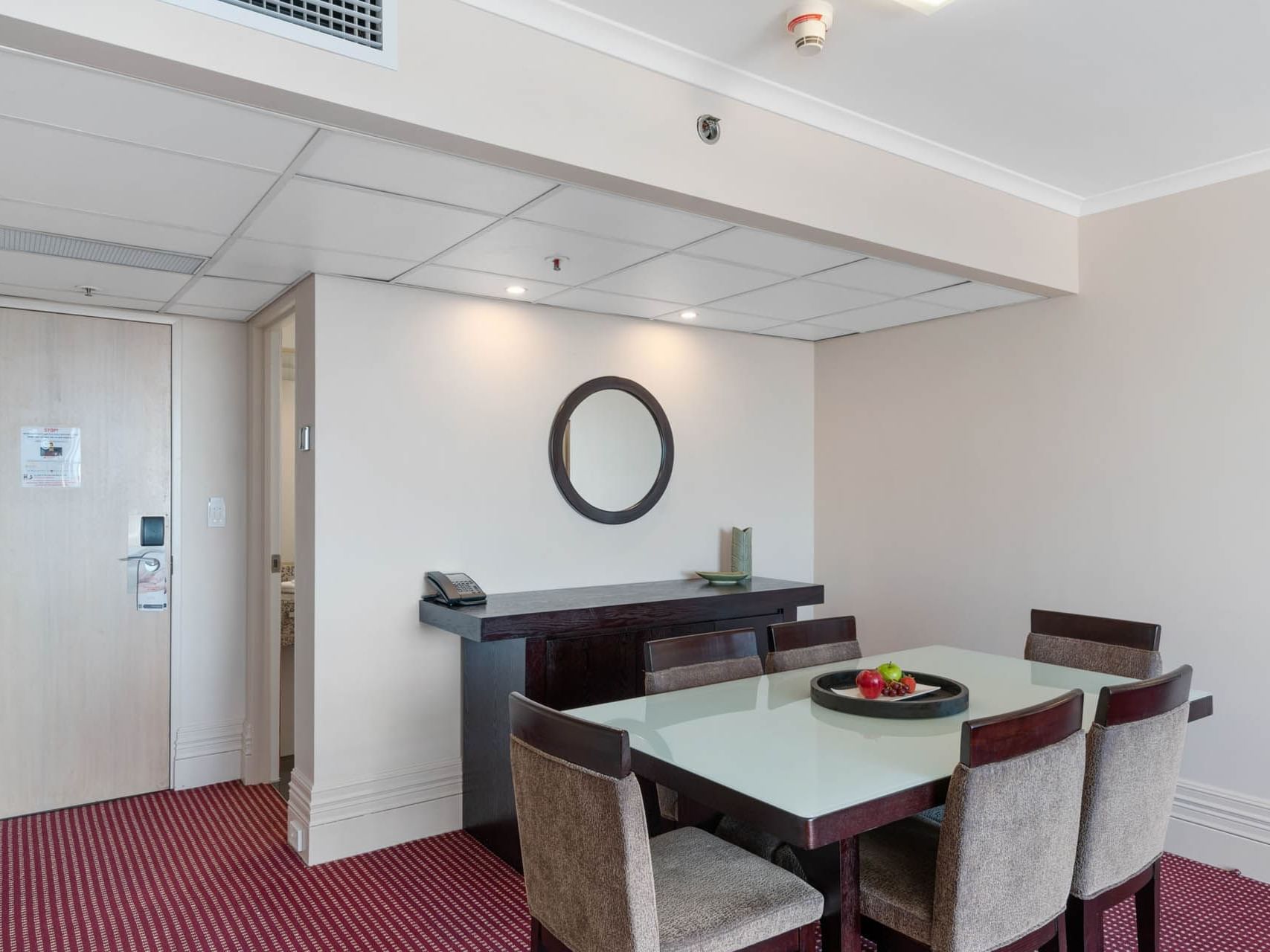 Dining table in State Suite with carpeted floors at Grand Chancellor Launceston