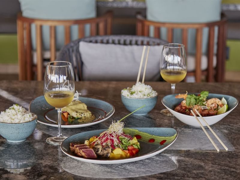 Thai dishes served with wine at FA Hotels & Resorts
