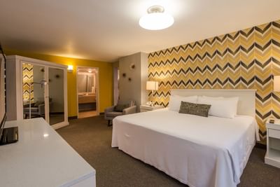 King bed and couch in Master Suite at Araiza Hotel Calafia