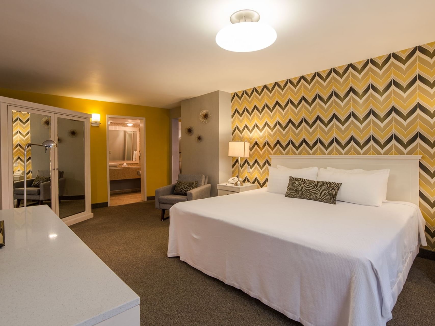 Bed & colorful wallpaper in Master Suite, Araiza Hotel Calafia