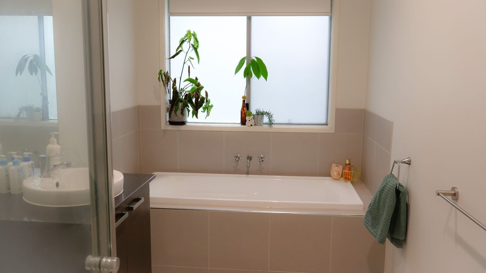 A clean bathroom with a bathtub and sink at La Trobe University Regional Housing - Ballarat.