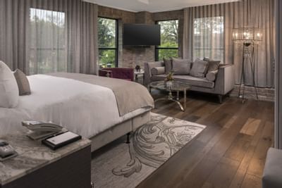 bed with wooden flooring