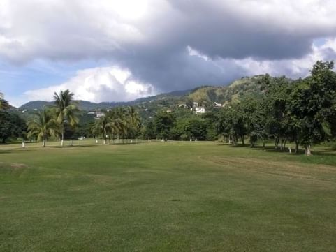 Constant Spring Golf Club near Jamaica Pegasus Hotel, with mountain backdrop, showcasing attractions in Kingston Jamaica 