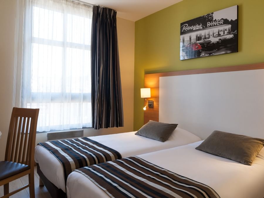A Superior twin Room up to 2 people at The Originals Hotels