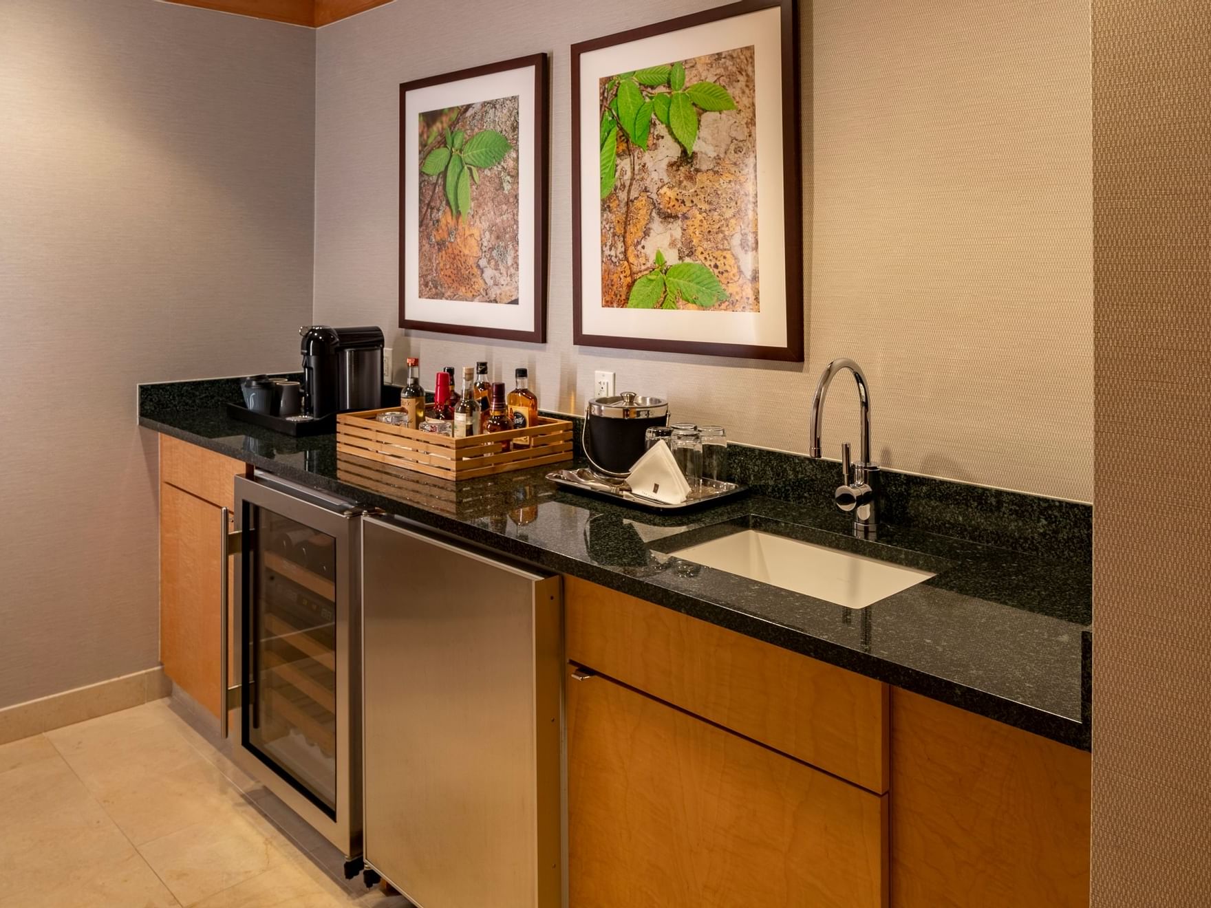 Kitchenette with appliances & original artwork in Presidential Suite at The Umstead Hotel and Spa