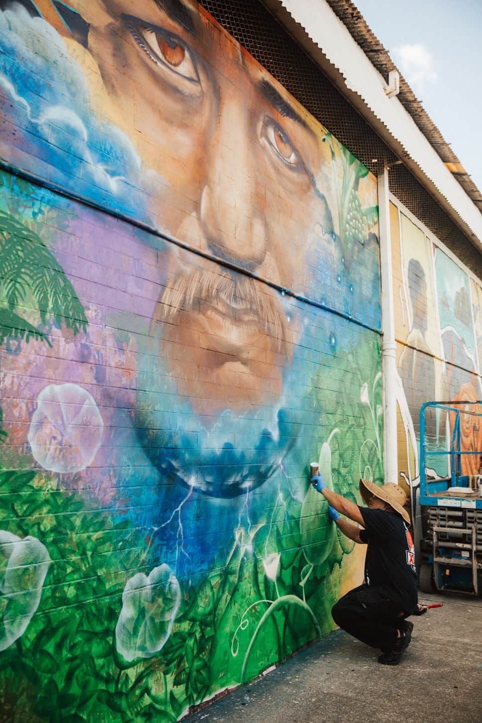 A person painting a street art in Hawaii near Waikiki Resort Hotel