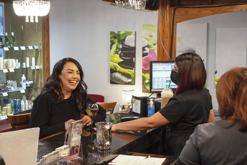 A client with a pleasant smile in the salon at MCM E. H .O