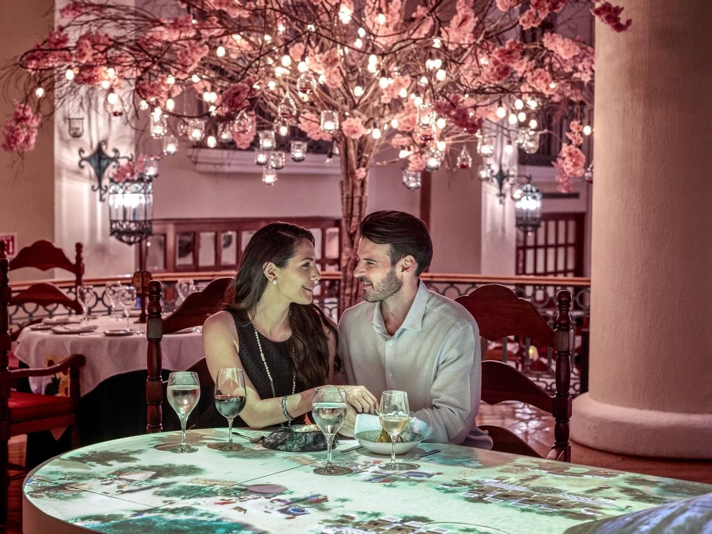 A couple by the dining table in La Joya, Grand Fiesta Americana